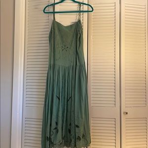 Mid length green dress. Amazing details!